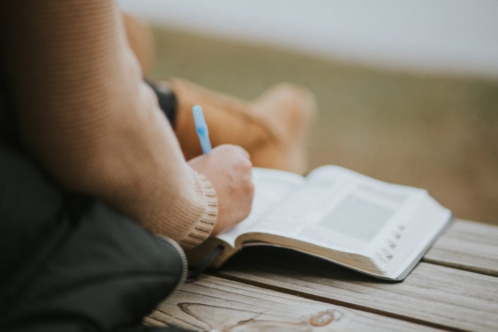 woman has overcome
 discouragement Biblically by studying God's Word
