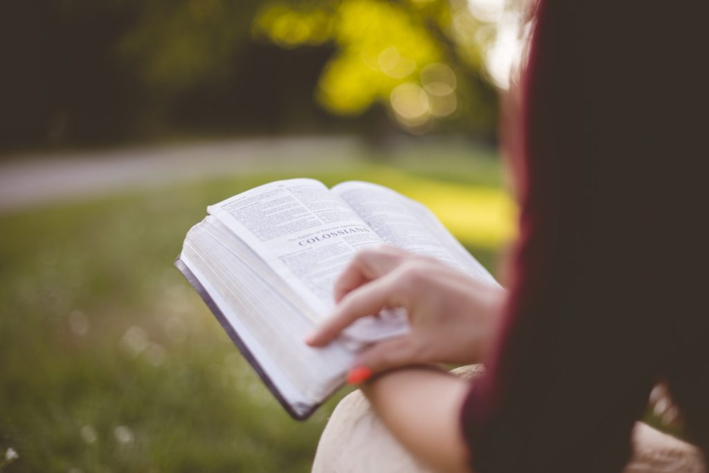 Woman reading Bible the third step to spiritual growth.