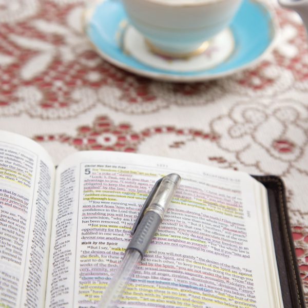 Bible pen and coffee cup. Fifth Step of Submitting to God: Applying God's Will
