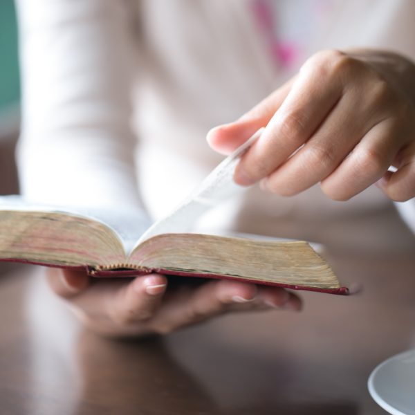 woman reading Bible Exploring the True Meaning of Grace in the Bible