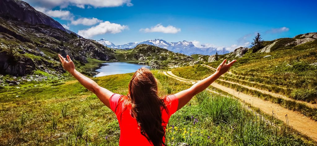 woman worshiping God in mountains Practical Steps to Embrace God's Sovereignty in Everyday Life
