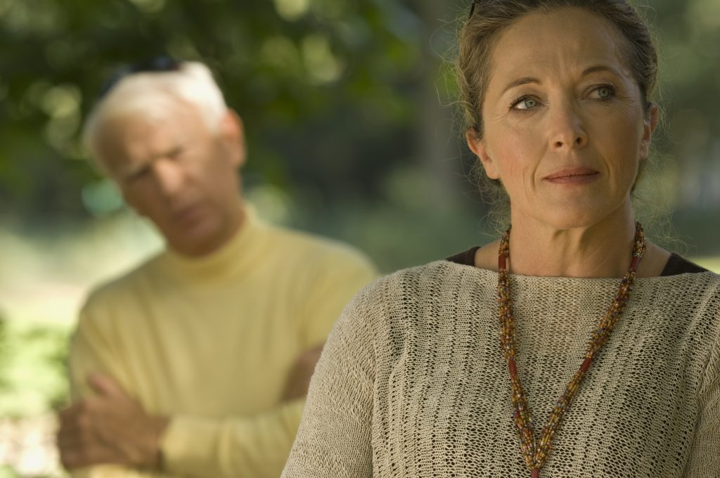 A man and a woman are arguing outside.  Controlling Your Anger as a Christian Woman