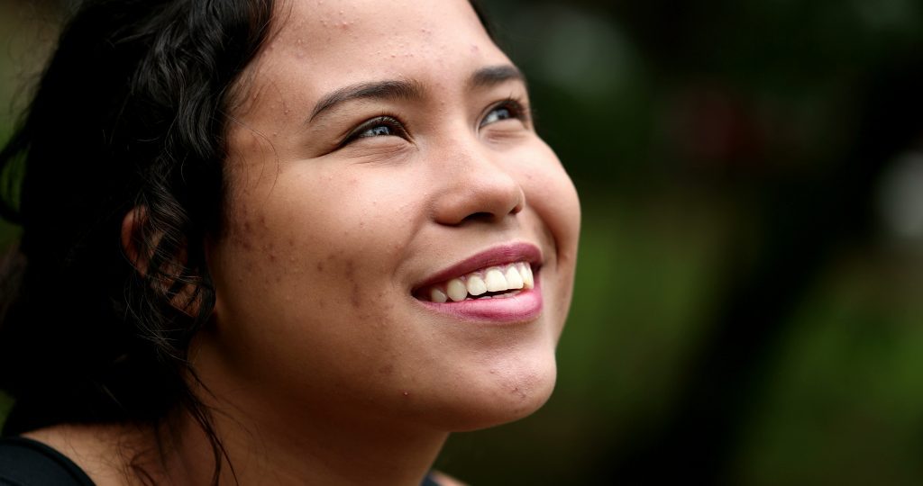 woman outside smiling hopefully at the sky. 5                 Practical Ways to Strengthen Your Hope in God