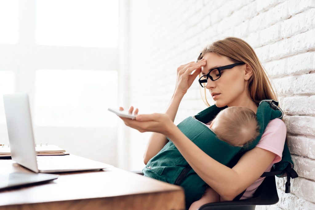 Woman with sleeping baby at computer-worn out.
Finding strength in God when you feel weak and worn out